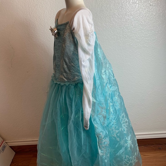 Disney store Elsa frozen costume for a girl .